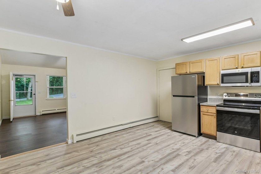 Tucked away on just over an acre in a private, wooded setting - photo 11