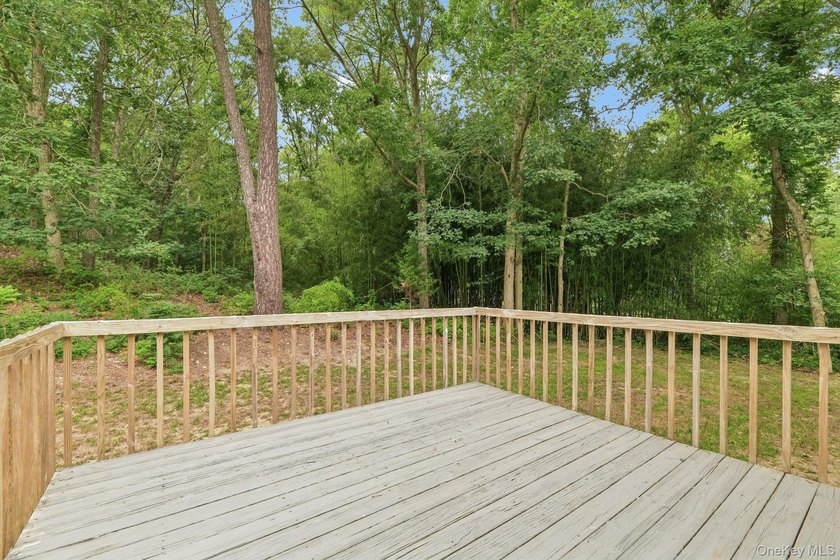 Tucked away on just over an acre in a private, wooded setting - photo 25