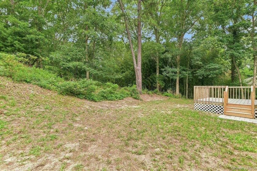 Tucked away on just over an acre in a private, wooded setting - photo 26