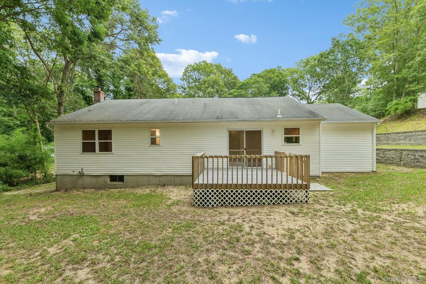 Tucked away on just over an acre in a private, wooded setting - photo 28