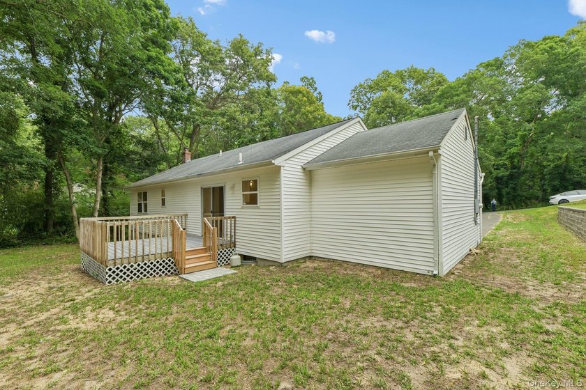 Tucked away on just over an acre in a private, wooded setting - photo 29
