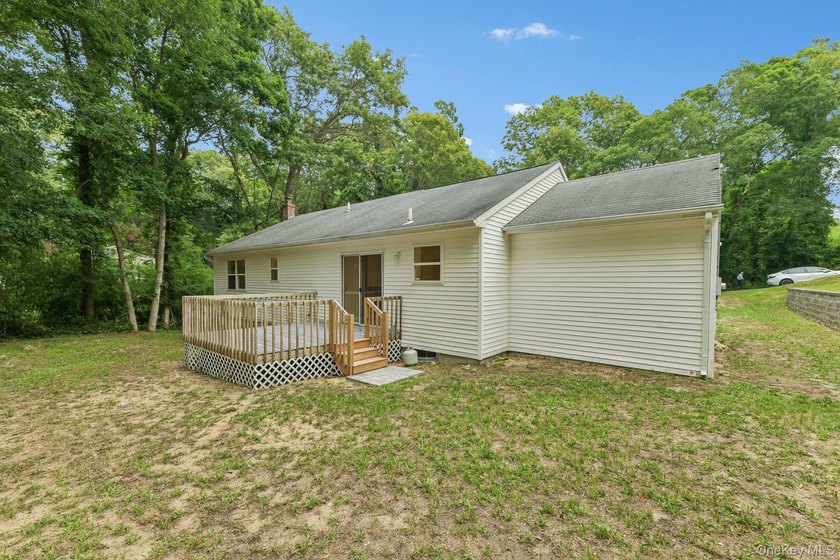 Tucked away on just over an acre in a private, wooded setting - photo 30