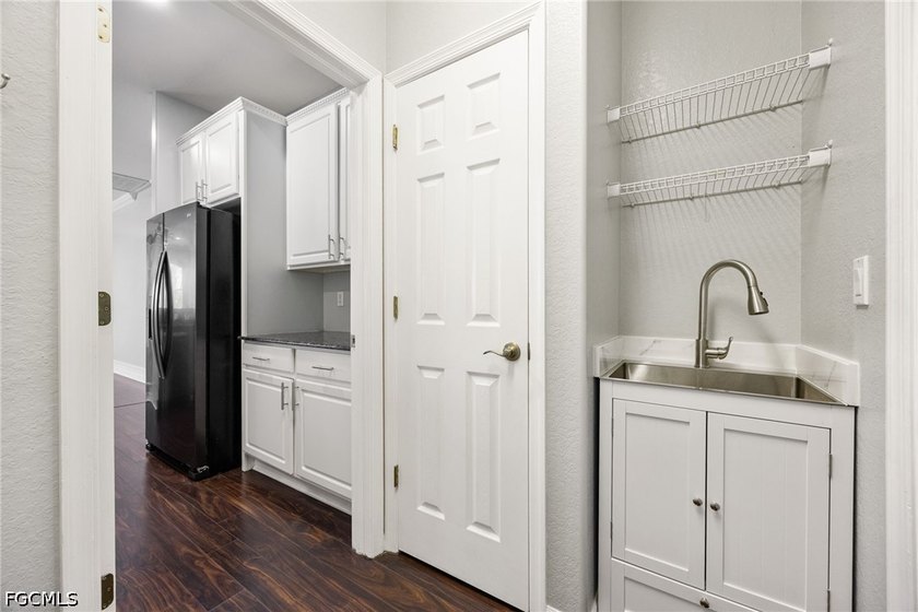 The spacious, open-concept floor plan features two living areas - photo 9