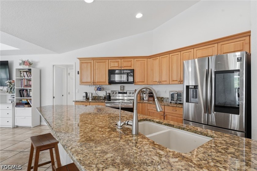Step into this well-maintained 3-bedroom, 2-bath pool home - photo 3