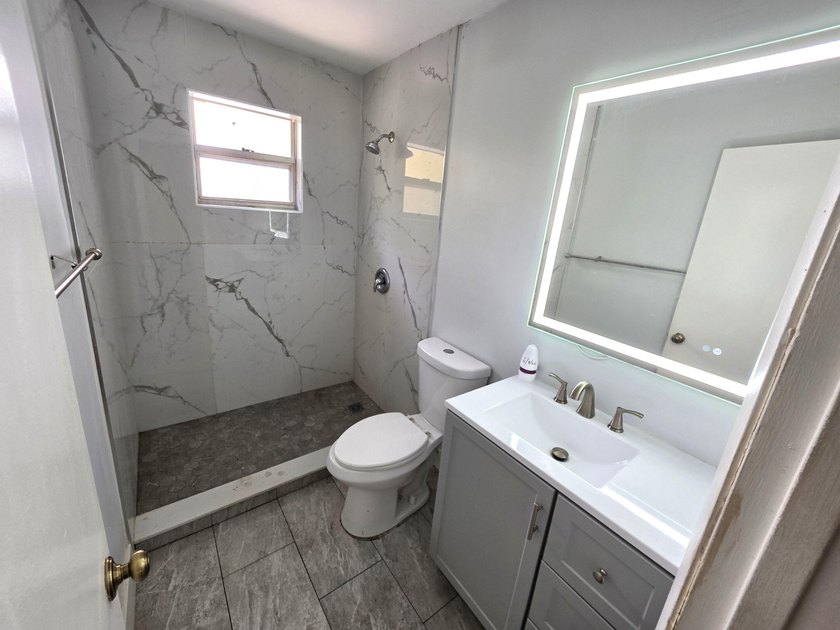 Discover this 3-bedroom, 2-bathroom home features an attached - photo 13