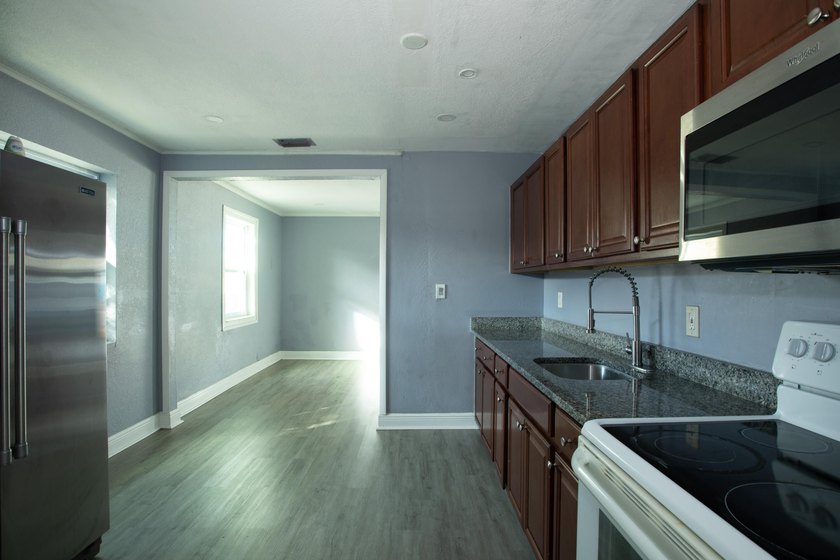 Home is move-in ready! This spacious 4-bedroom, 2-bath - photo 6