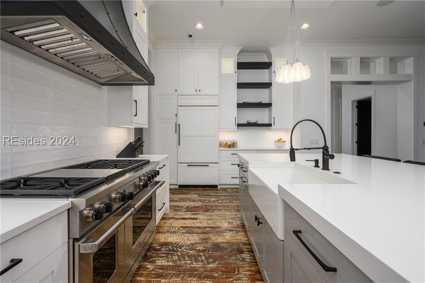 Delight in the welcoming luxury of this four-bedroom - photo 9