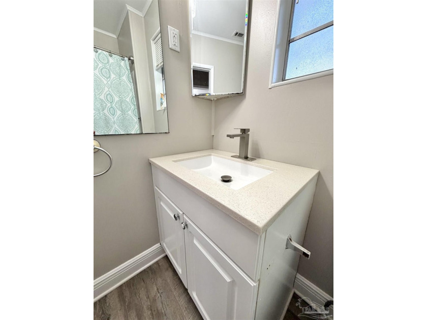 Fully renovated and move-in ready! This charming 3-bedroom - photo 12