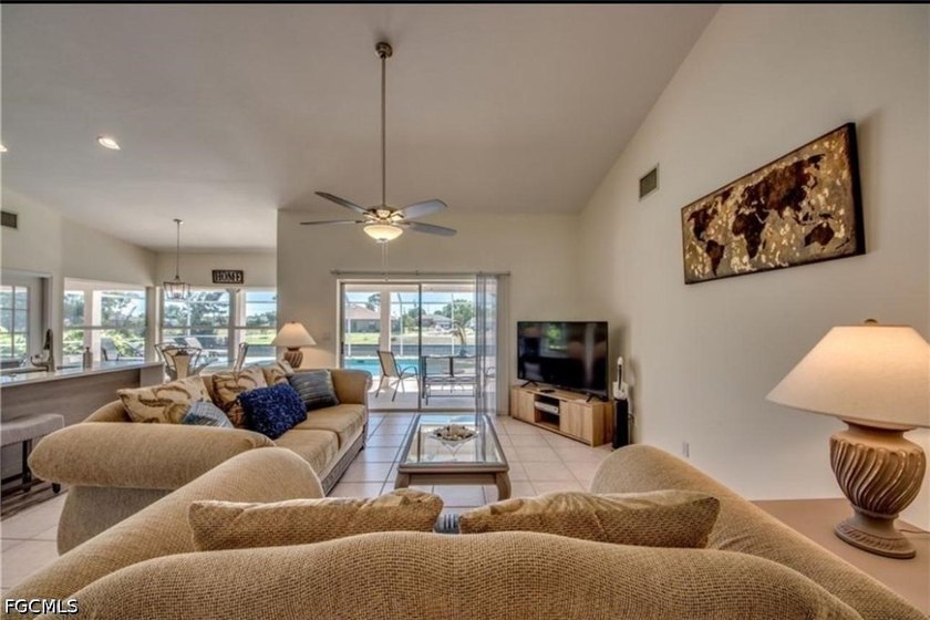 Welcome to this spacious waterfront pool home located in a - photo 3