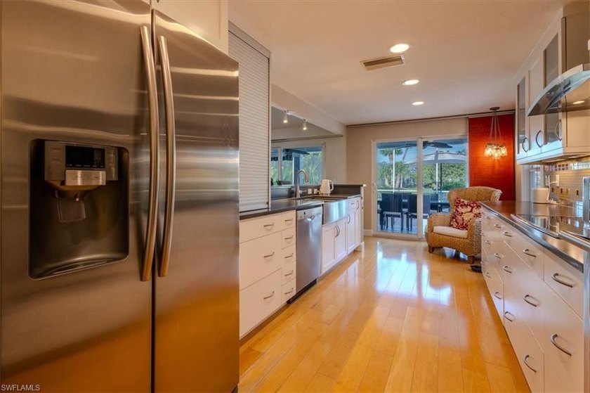 Discover this exceptional lakefront pool home in the highly - photo 12