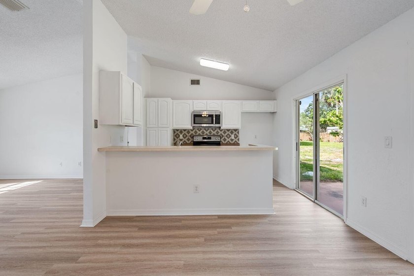 FRESHLY REMODELED Palm Bay home featuring a brand-new roof - photo 7