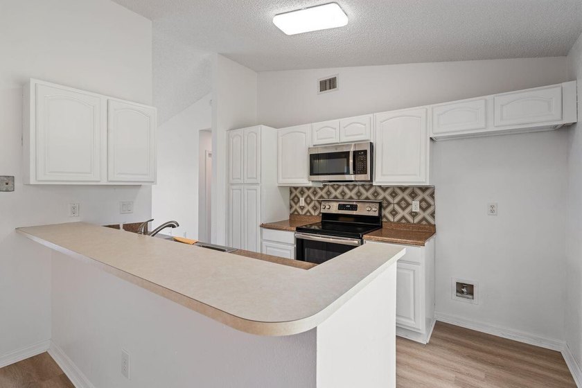 FRESHLY REMODELED Palm Bay home featuring a brand-new roof - photo 8