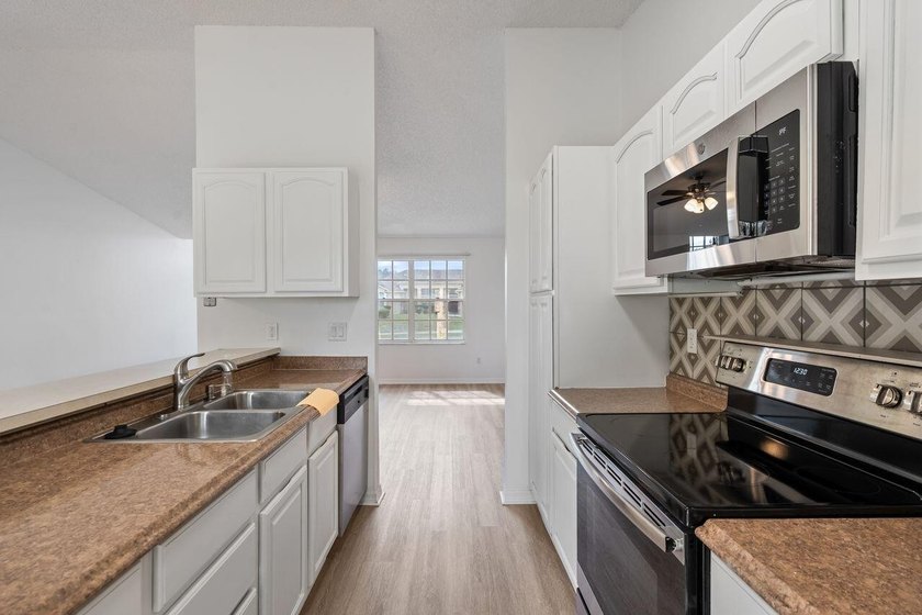 FRESHLY REMODELED Palm Bay home featuring a brand-new roof - photo 9