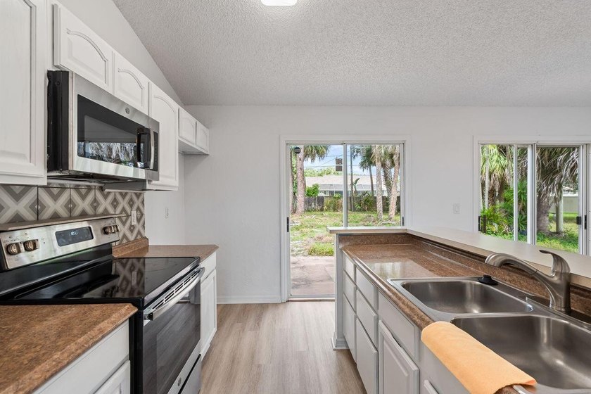 FRESHLY REMODELED Palm Bay home featuring a brand-new roof - photo 10