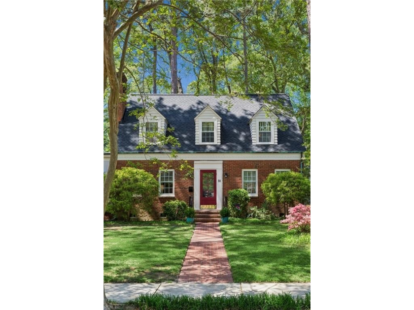 Nestled on a picturesque, wooded lot, this charming Cape Cod is - photo 3