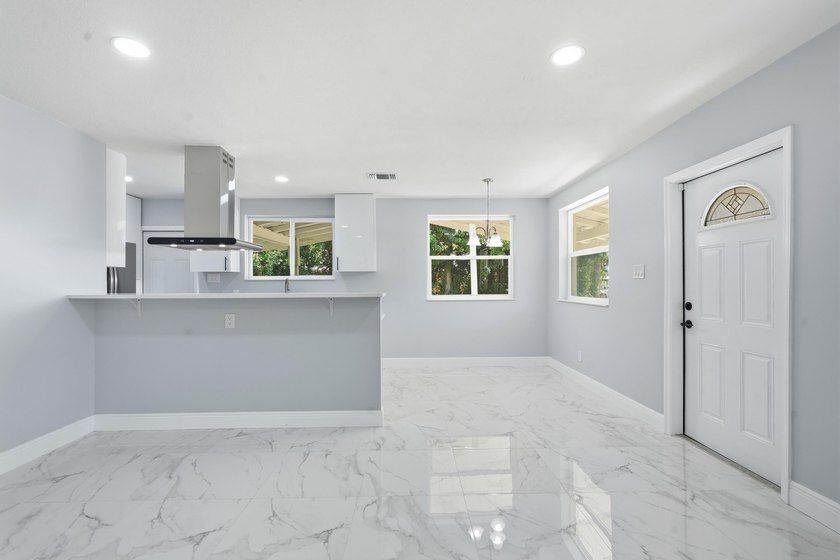 This charming single family home is tucked away in the back - photo 11