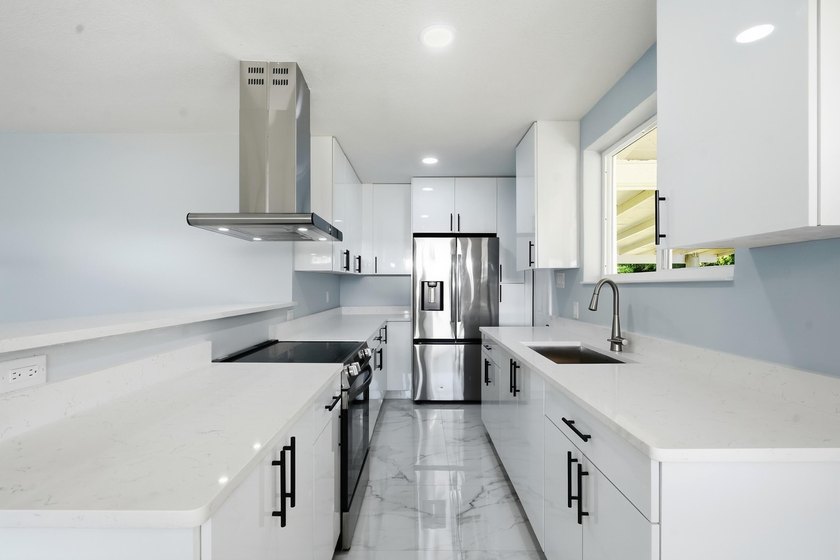This charming single family home is tucked away in the back - photo 12