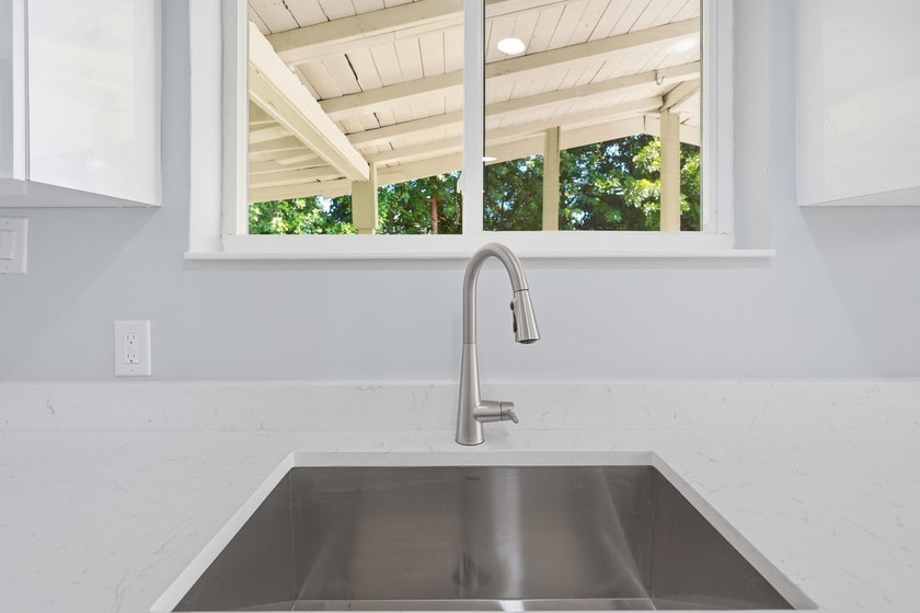 This charming single family home is tucked away in the back - photo 14