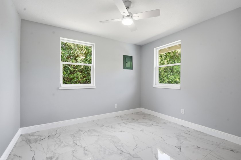 This charming single family home is tucked away in the back - photo 16