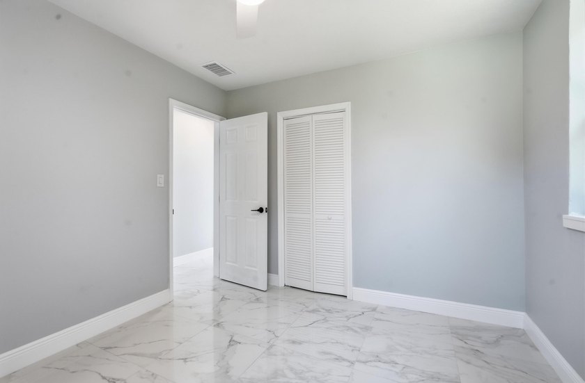 This charming single family home is tucked away in the back - photo 17