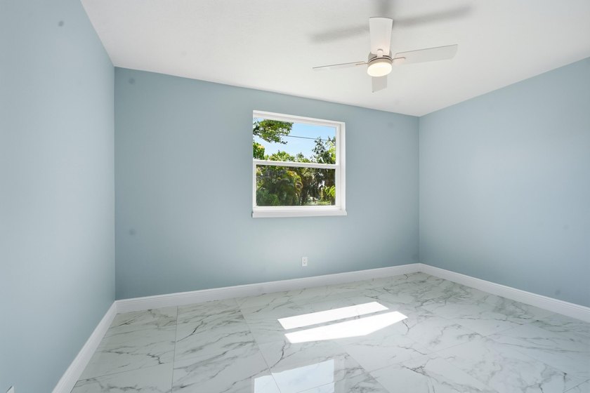 This charming single family home is tucked away in the back - photo 18