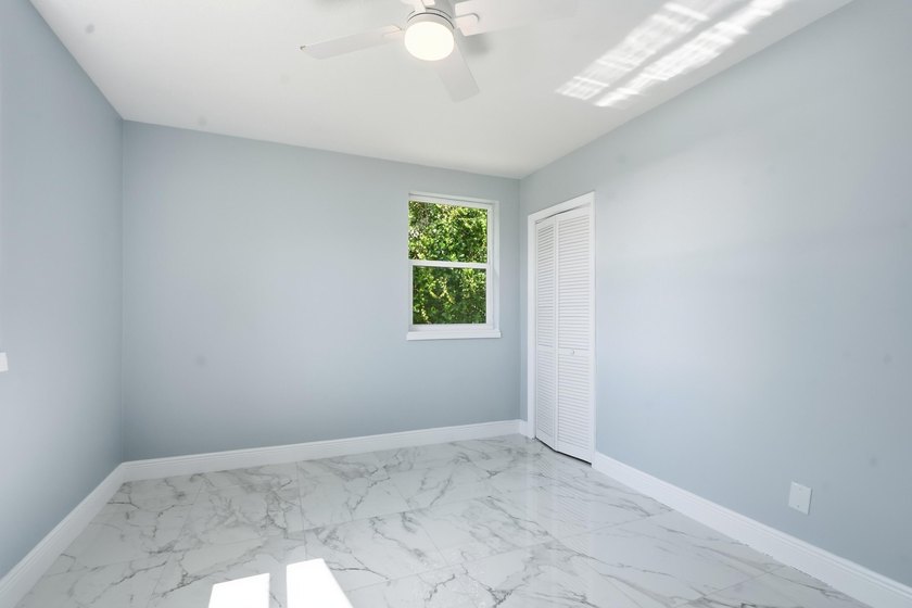 This charming single family home is tucked away in the back - photo 19