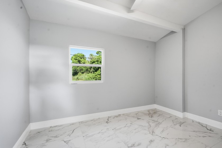 This charming single family home is tucked away in the back - photo 20