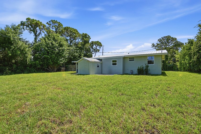 This charming single family home is tucked away in the back - photo 27
