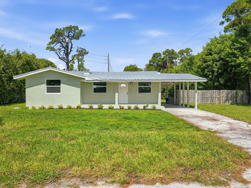 This charming single family home is tucked away in the back - photo 29