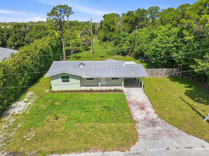 This charming single family home is tucked away in the back - photo 30