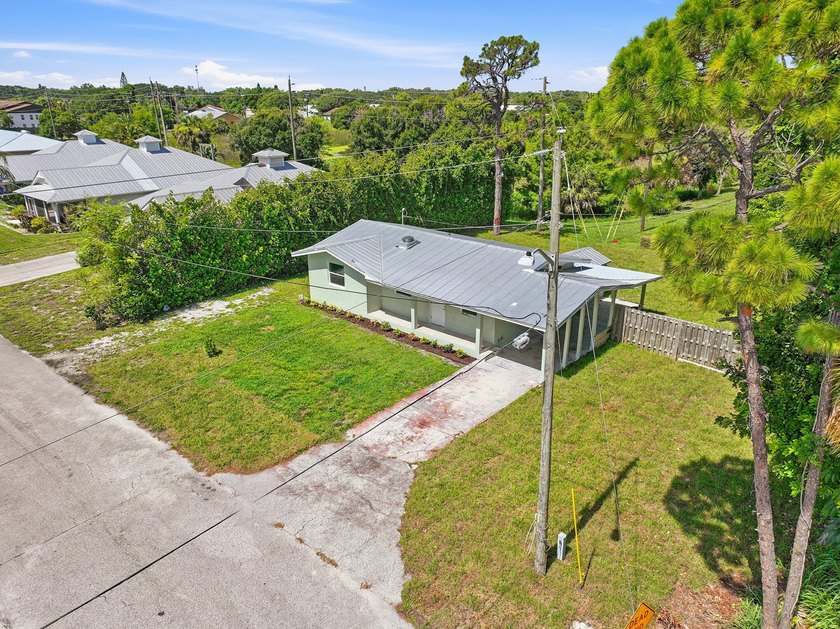 This charming single family home is tucked away in the back - photo 31