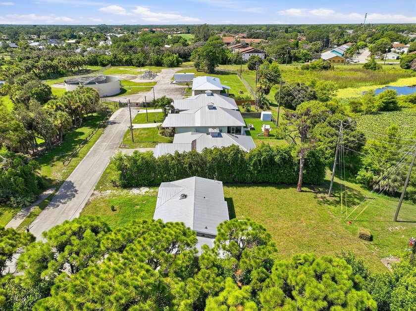 This charming single family home is tucked away in the back - photo 32