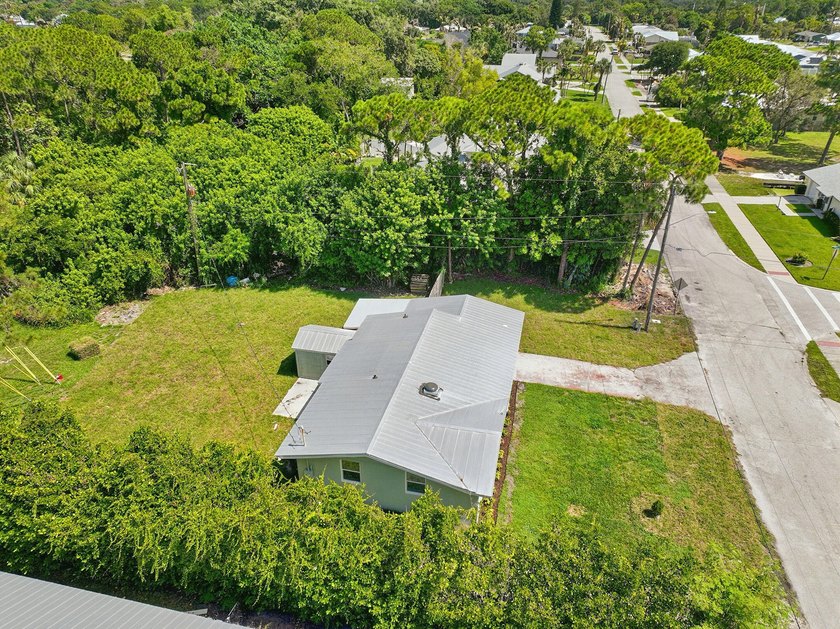 This charming single family home is tucked away in the back - photo 35