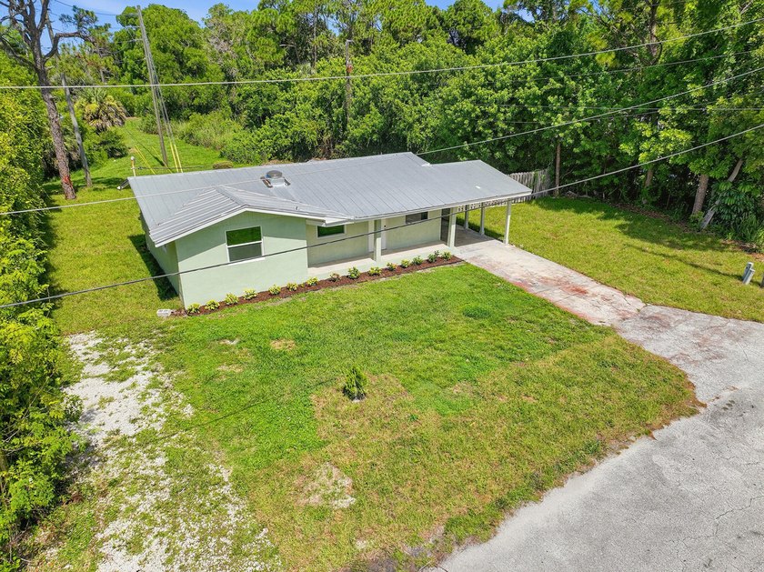 This charming single family home is tucked away in the back - photo 36