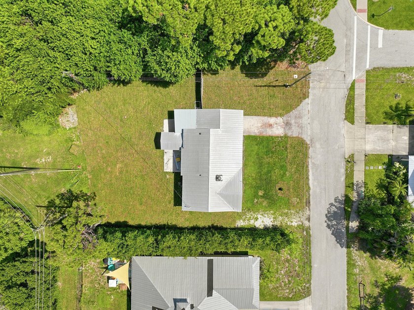 This charming single family home is tucked away in the back - photo 41
