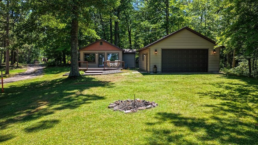 Escape to this charming four-season cabin on highly sought-after - photo 16