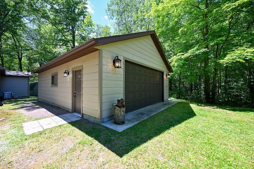 Escape to this charming four-season cabin on highly sought-after - photo 20