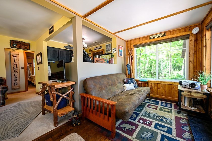 Escape to this charming four-season cabin on highly sought-after - photo 33