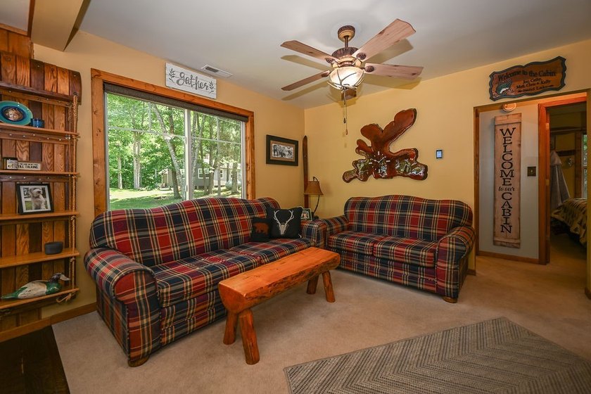 Escape to this charming four-season cabin on highly sought-after - photo 35