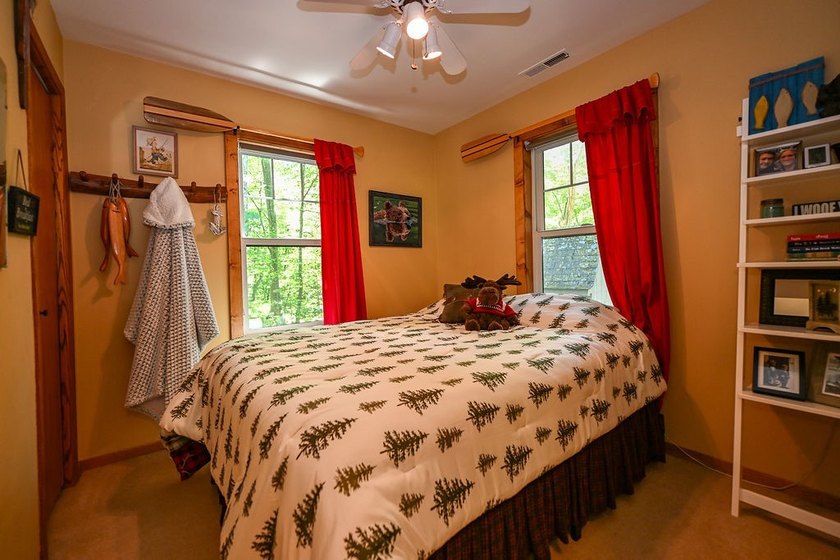 Escape to this charming four-season cabin on highly sought-after - photo 45