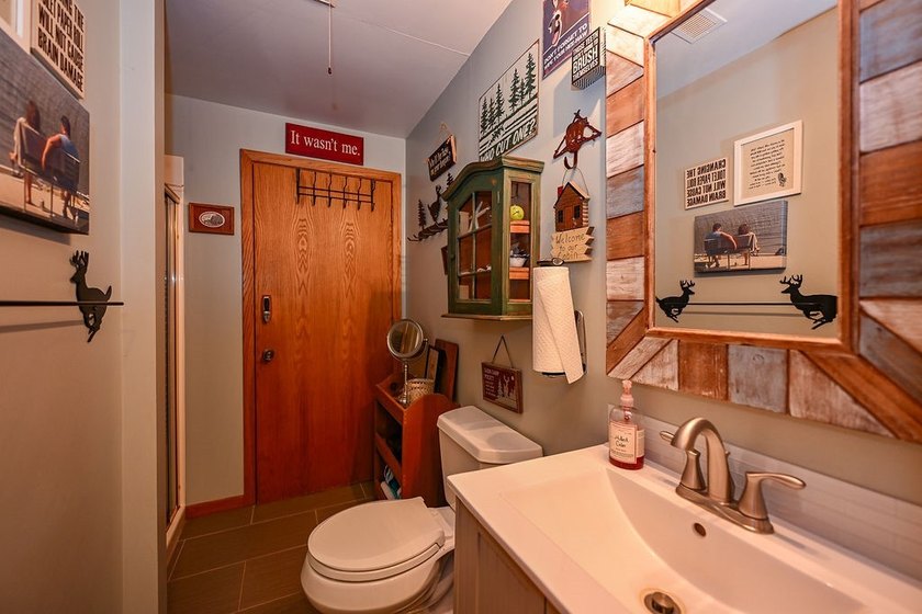 Escape to this charming four-season cabin on highly sought-after - photo 46