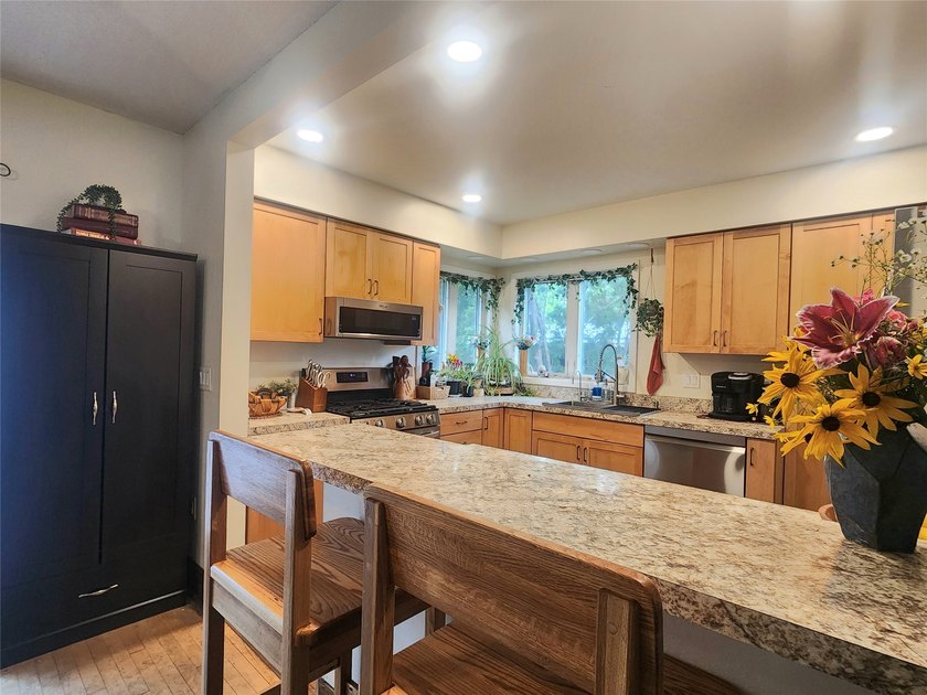 Nestled in a quiet, tree-lined neighborhood, this three-bedroom - photo 11