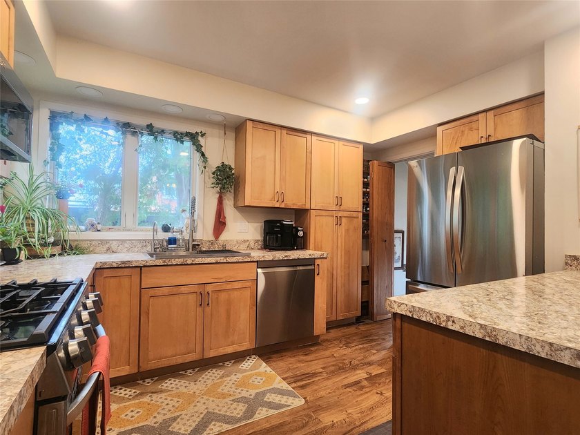 Nestled in a quiet, tree-lined neighborhood, this three-bedroom - photo 12