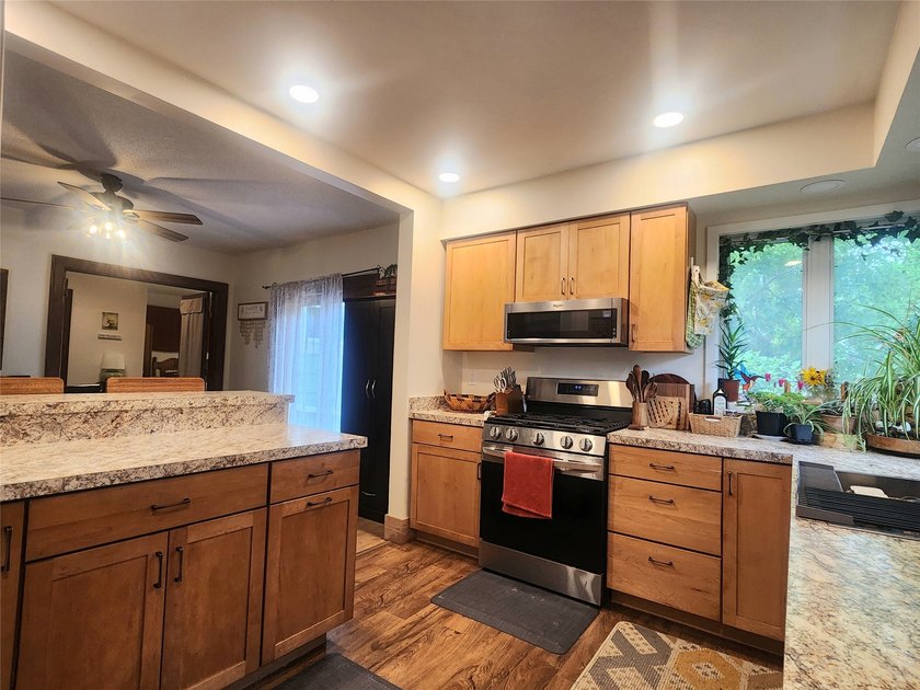 Nestled in a quiet, tree-lined neighborhood, this three-bedroom - photo 13