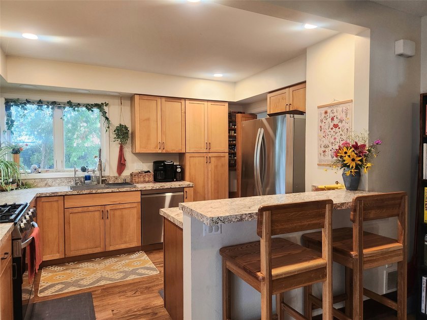 Nestled in a quiet, tree-lined neighborhood, this three-bedroom - photo 14