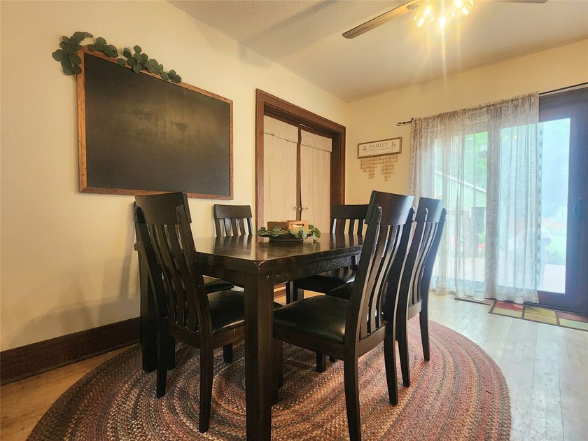 Nestled in a quiet, tree-lined neighborhood, this three-bedroom - photo 16
