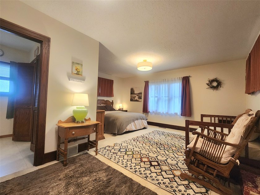 Nestled in a quiet, tree-lined neighborhood, this three-bedroom - photo 17