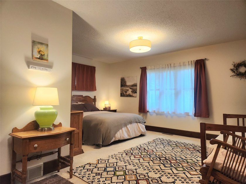 Nestled in a quiet, tree-lined neighborhood, this three-bedroom - photo 18