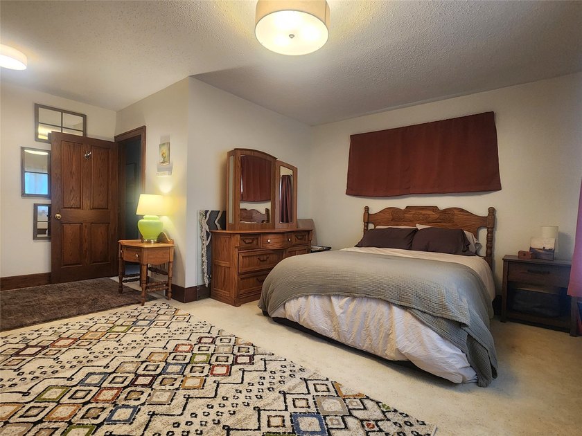 Nestled in a quiet, tree-lined neighborhood, this three-bedroom - photo 19