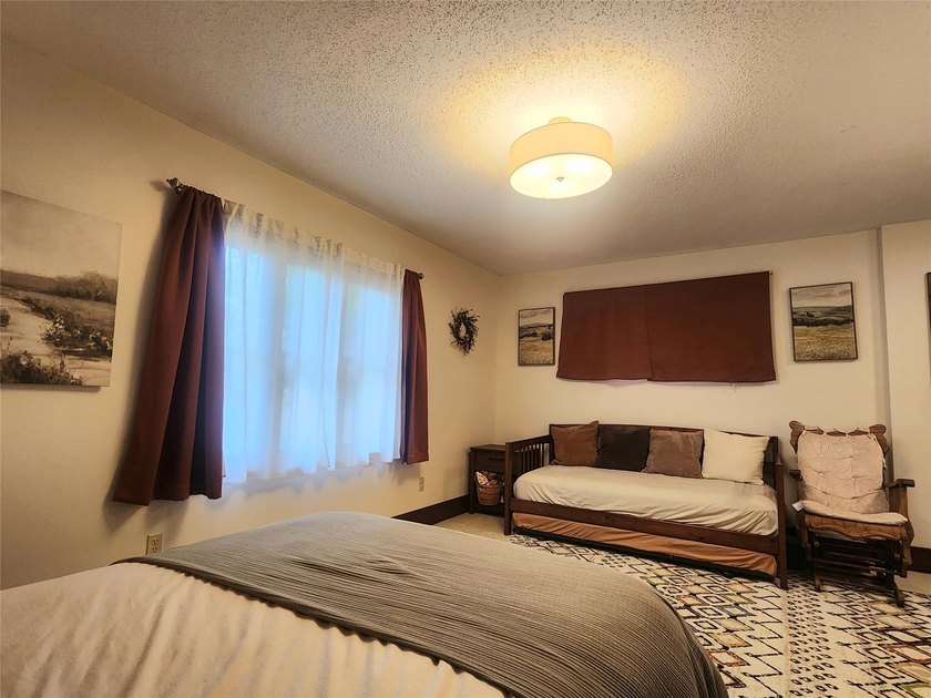 Nestled in a quiet, tree-lined neighborhood, this three-bedroom - photo 21
